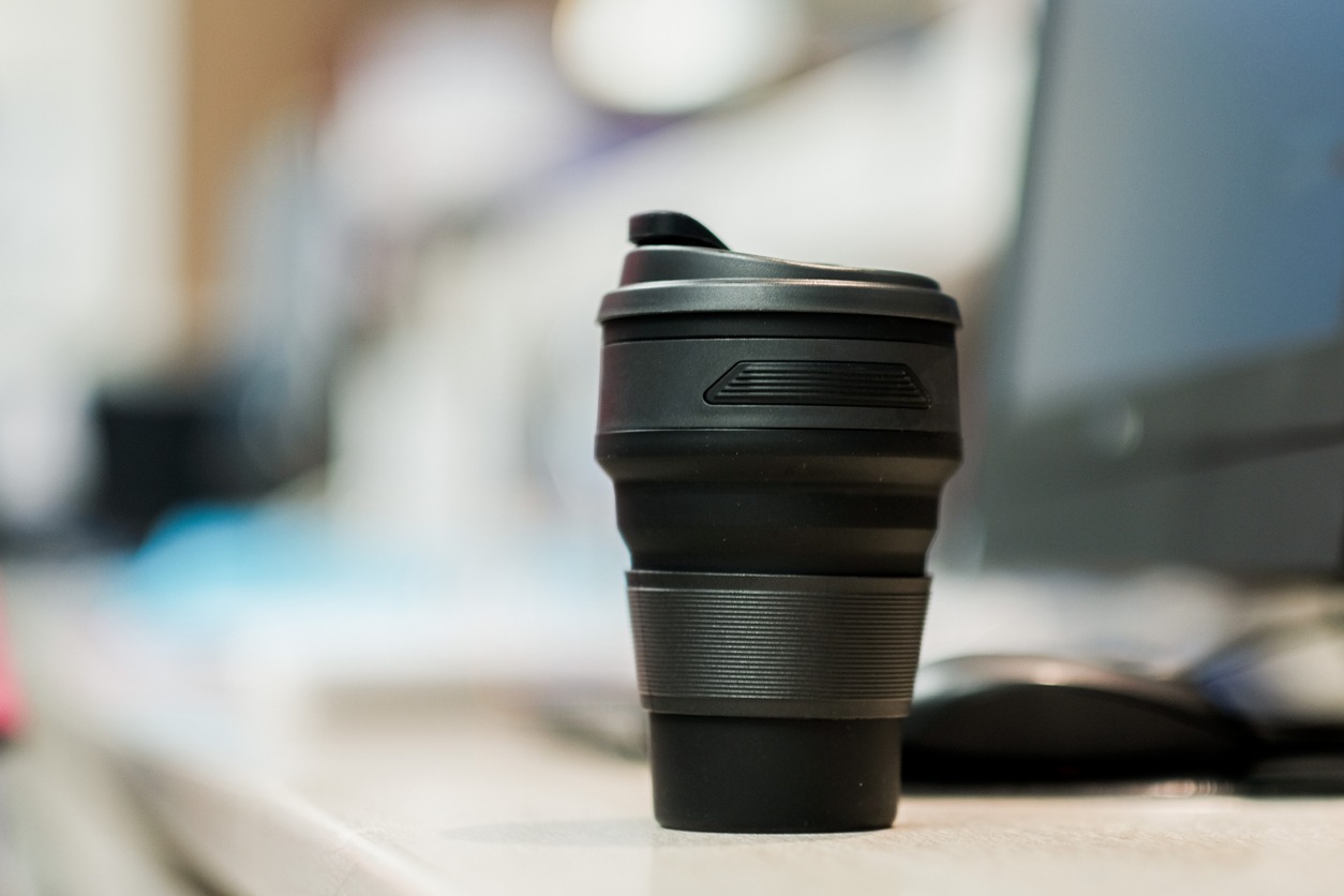 Black silicone coffee mug in office