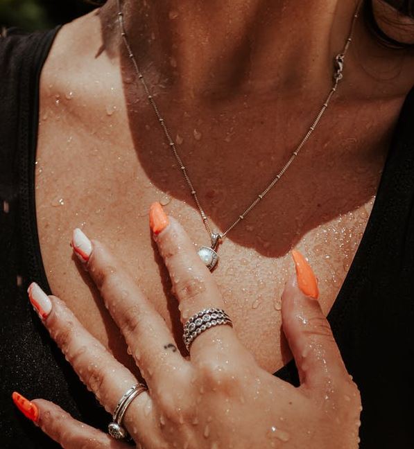 wearing silver jewelries