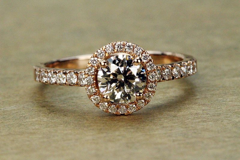 A rose gold engagement ring with studs of diamonds