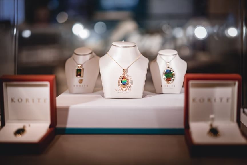 Multiple gemstone necklaces on display 