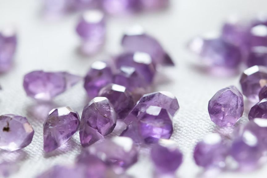 Purple gemstones on a surface