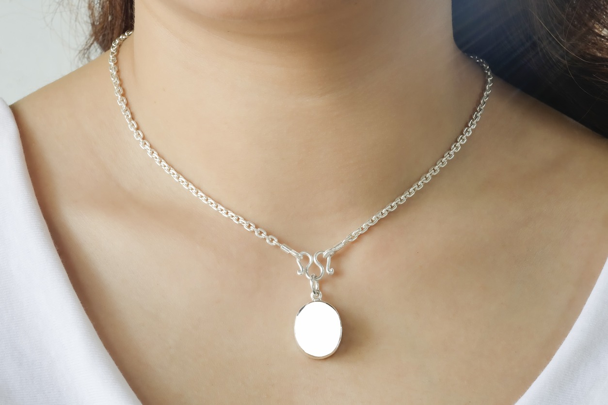 Woman wearing a mockup montage necklace with empty for add your advertising.
